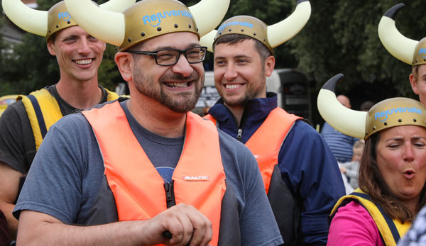 Rejuvenate IT staff in Viking helmets and buoyancy aids at the dragon boat race