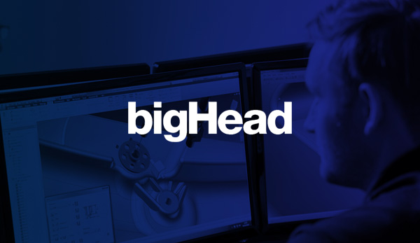 bigHead logo over an engineer working at CAD screens