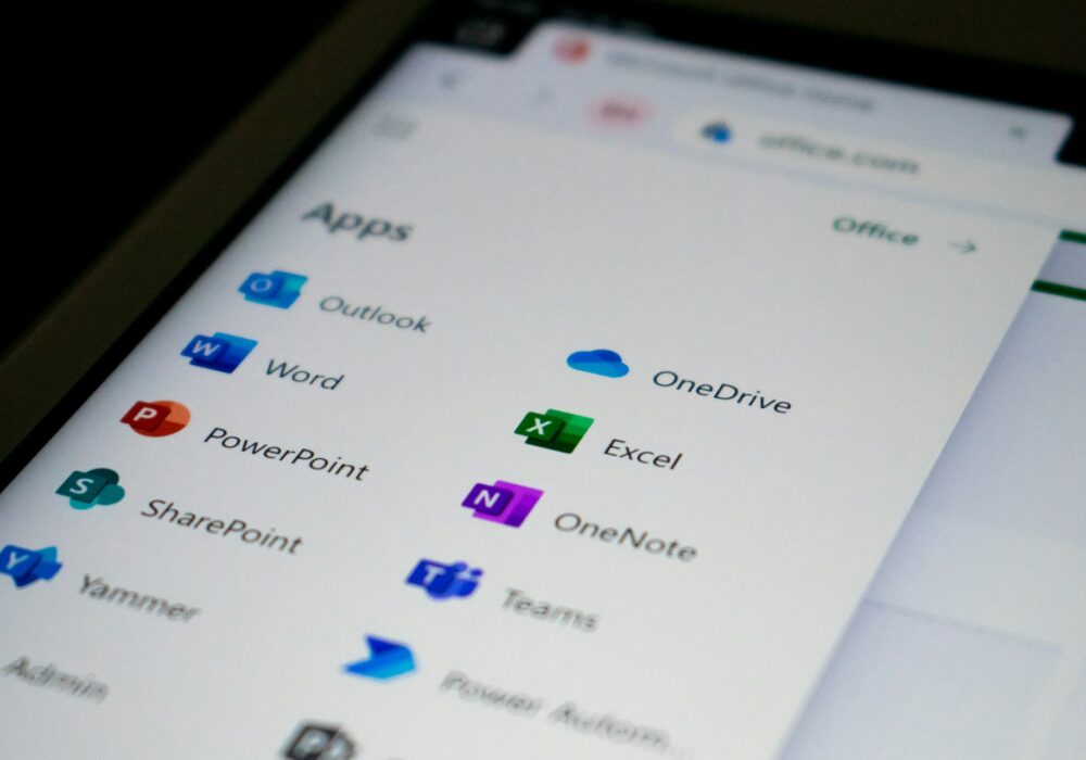 The Microsoft 365 app launcher listing Outlook, Word, Excel, Teams and OneDrive