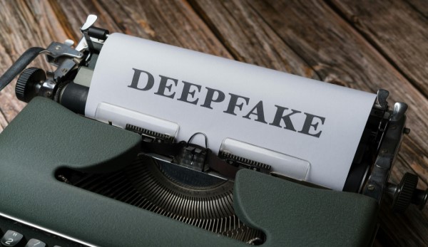 A typewriter with the word deepfakes on it